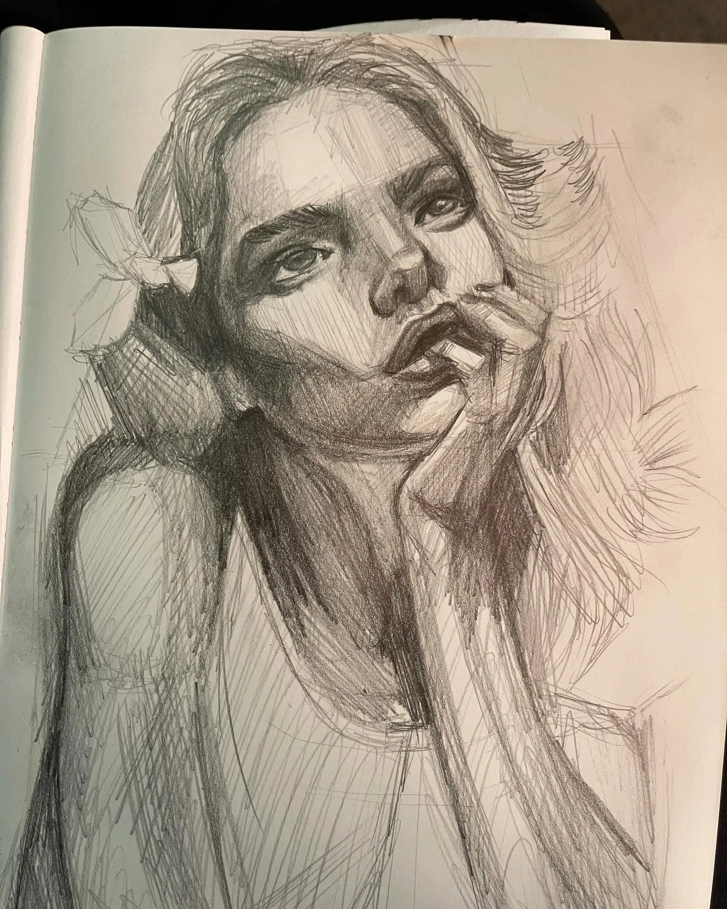 Pencil sketch of a woman resting her chin on her hand