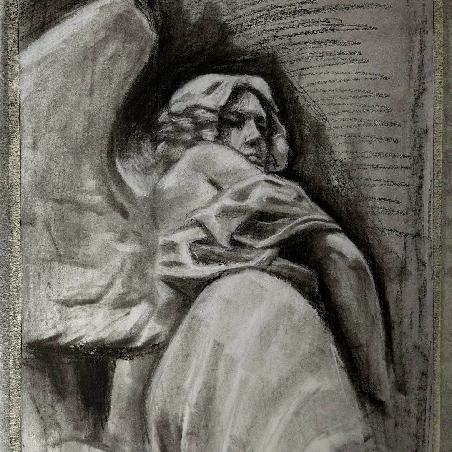 Charcoal drawing of a figure wrapped in drapery