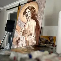 The gold halo painting on the easel in the studio