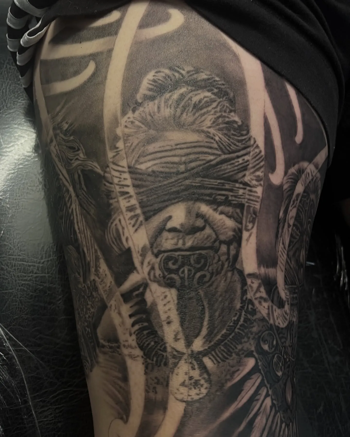 Black and grey realism piece of a veiled face