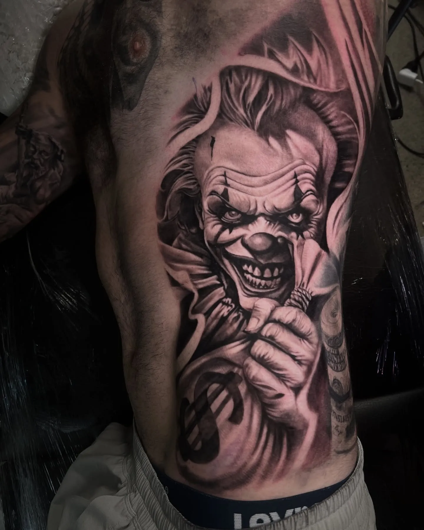 Black and grey clown portrait on the side