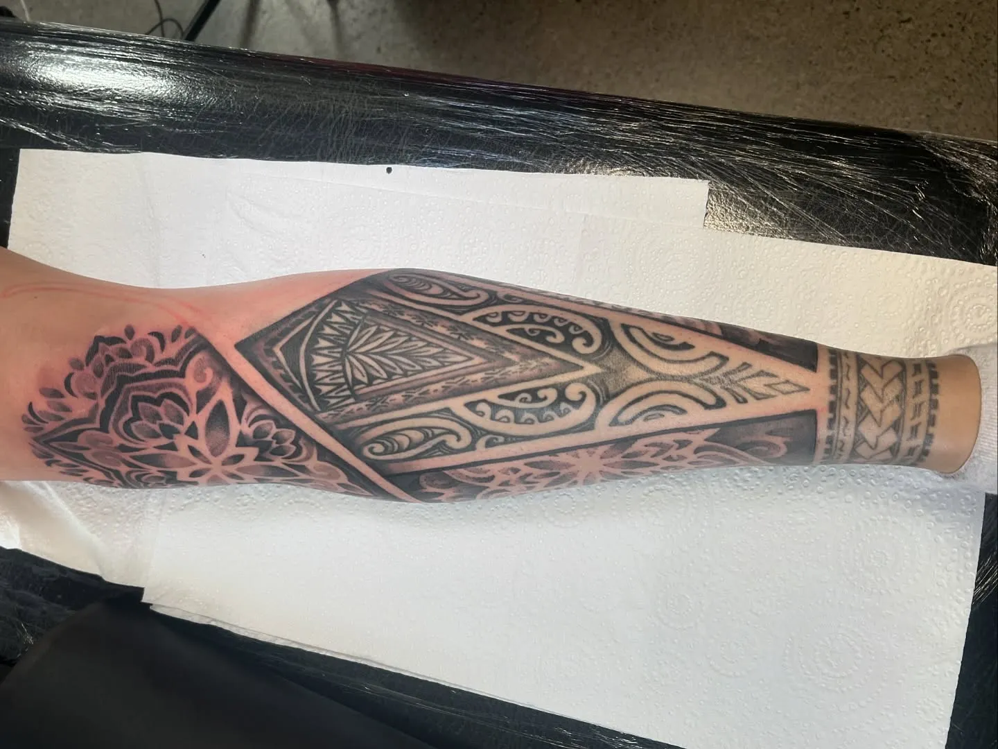 Polynesian and mandala forearm sleeve in black and grey