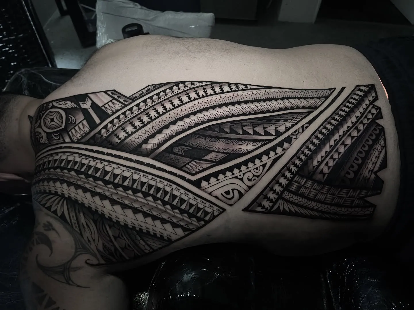 Polynesian tatau across the back and side